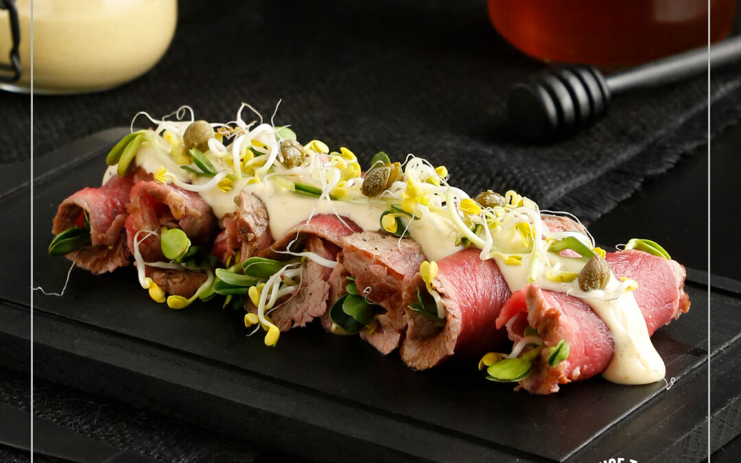 Beef rolls with rocket, sprouts and honey mustard sauce